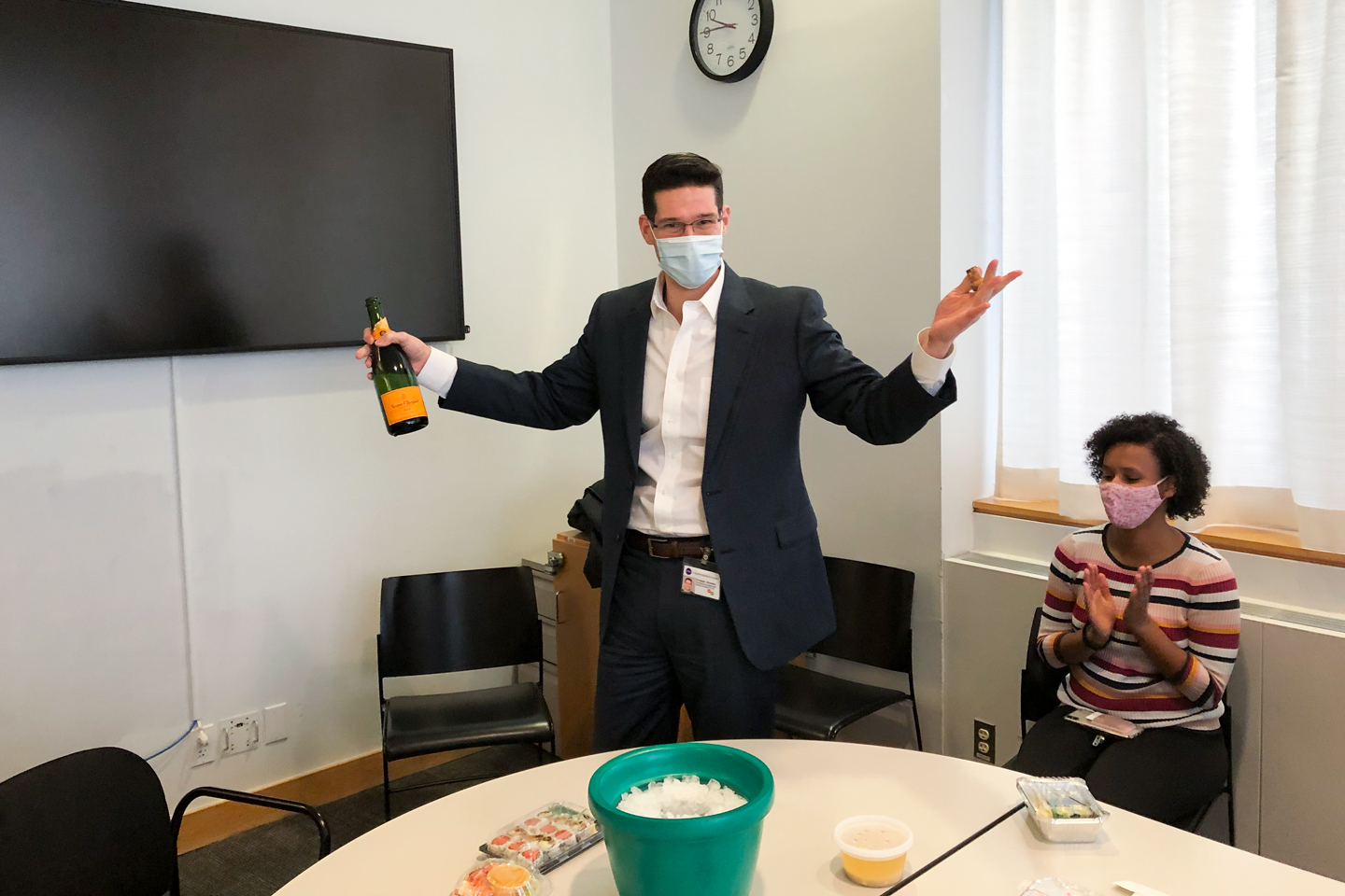 Members of the Wang Lab Celebrate with Champagne