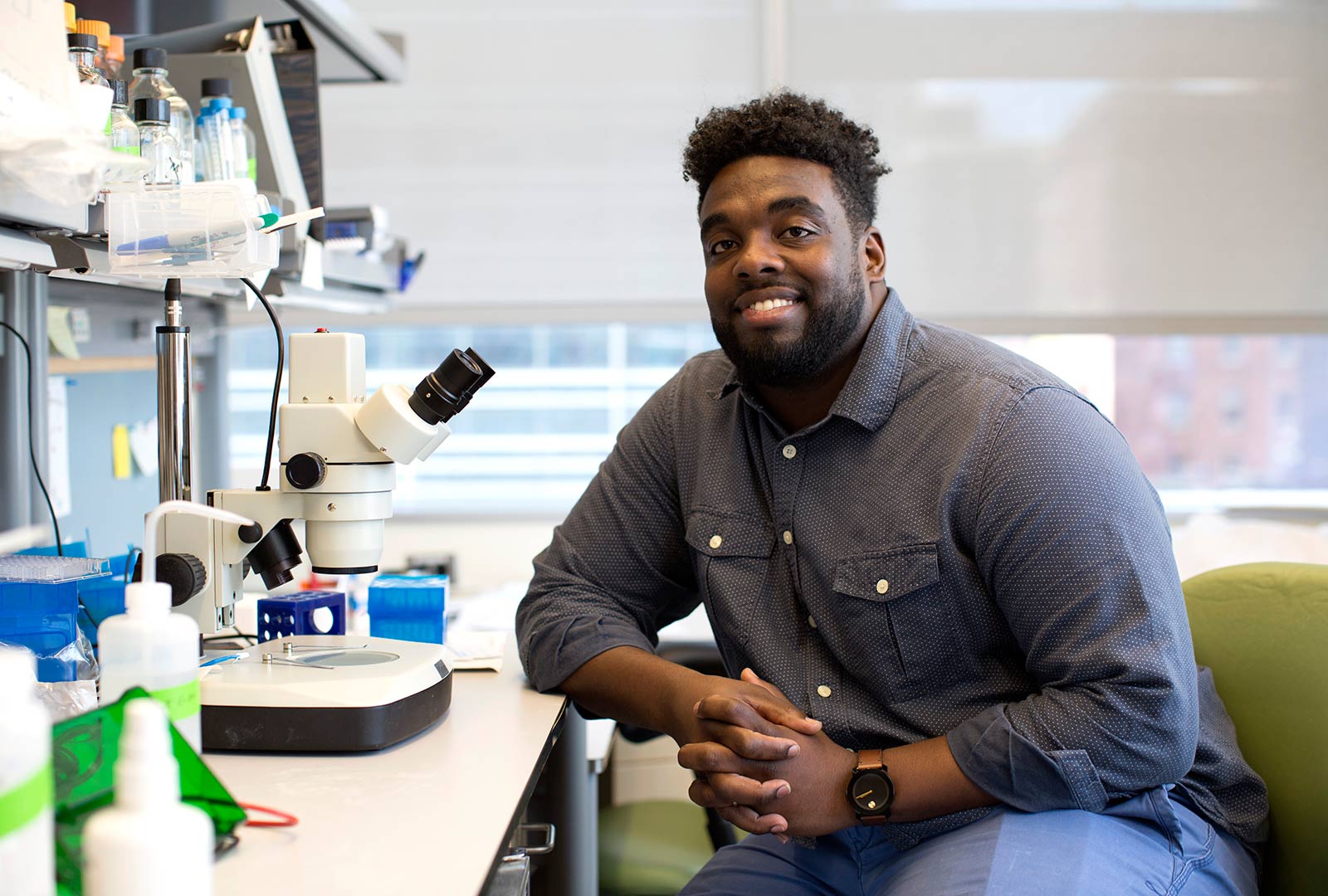 PhD Candidate Ledet Russel Sitting at Lab Bench